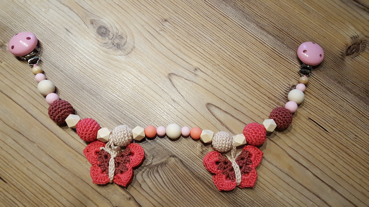 Kinderwagenkette "Schmetterlinge" rosa