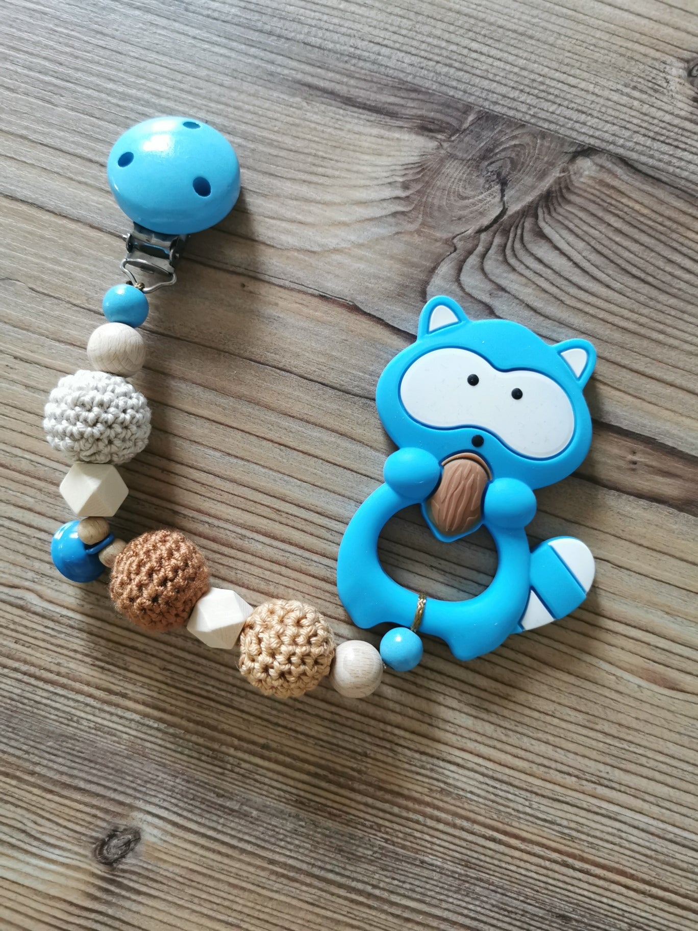Beißanhänger "Waschbär" blau